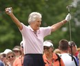 Kathy Whitworth responds to the crowd as she prepares to tee off during the Tournament of Champions golf tournament at Locust Hill Country Club in Pittsford, N.Y. on June 20, 2006.